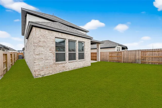 a view of a backyard with a garden and plants