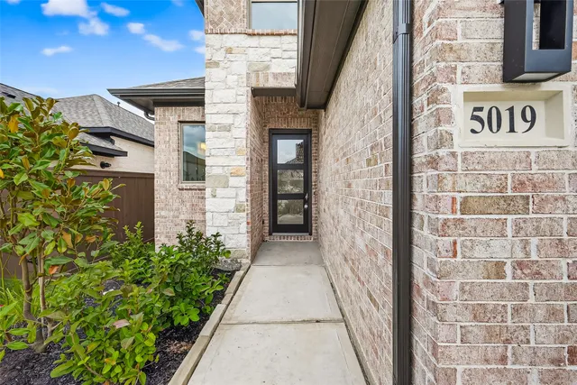 a view of a pathway along with potted plants