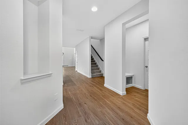 a view of entryway with wooden floor