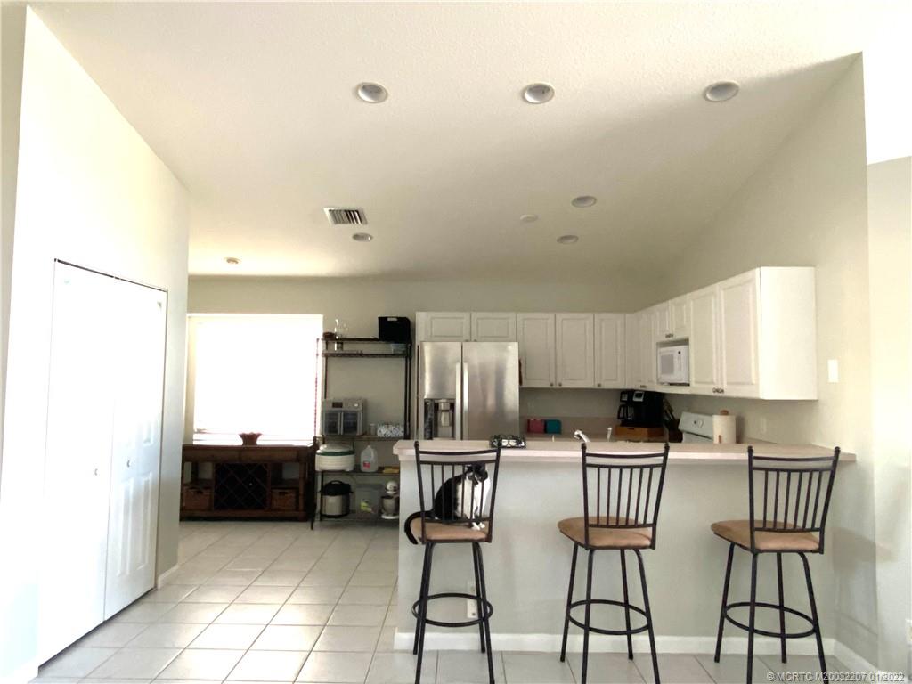 2843 Southwest Montego Terrace Stuart, FL 34997 - Photo 7 of 20 kitchen view with bar
