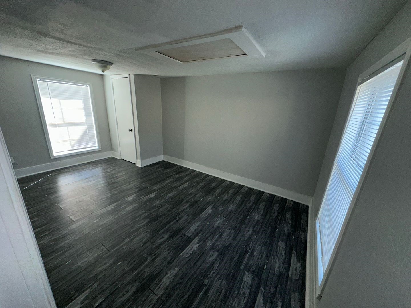 412 North 8th Street, Unit 1 Pasadena, TX 77502 - Photo 15 of 17 a view of an empty room with wooden floor and a window