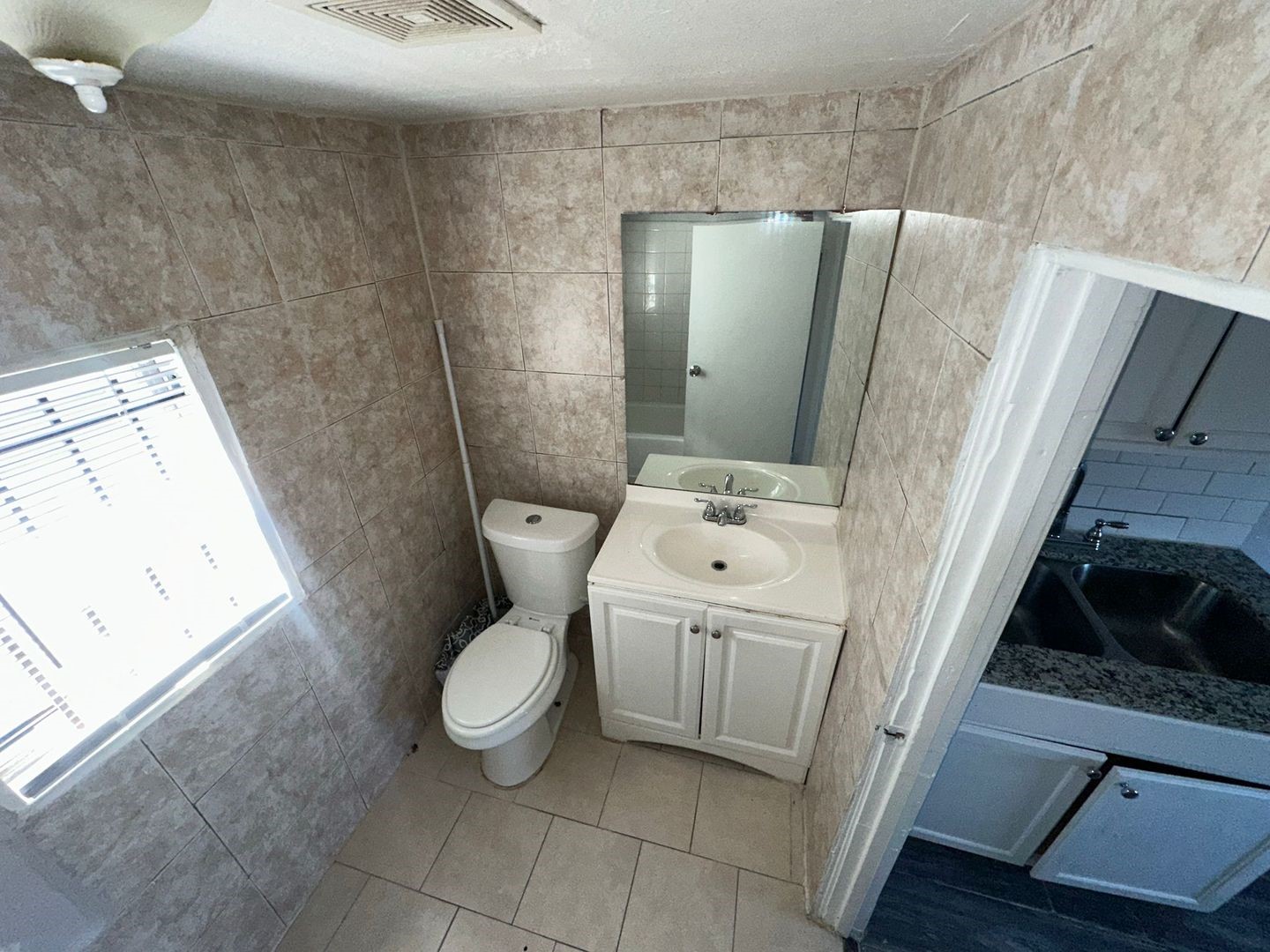 412 North 8th Street, Unit 1 Pasadena, TX 77502 - Photo 17 of 17 a bathroom with a toilet and a sink