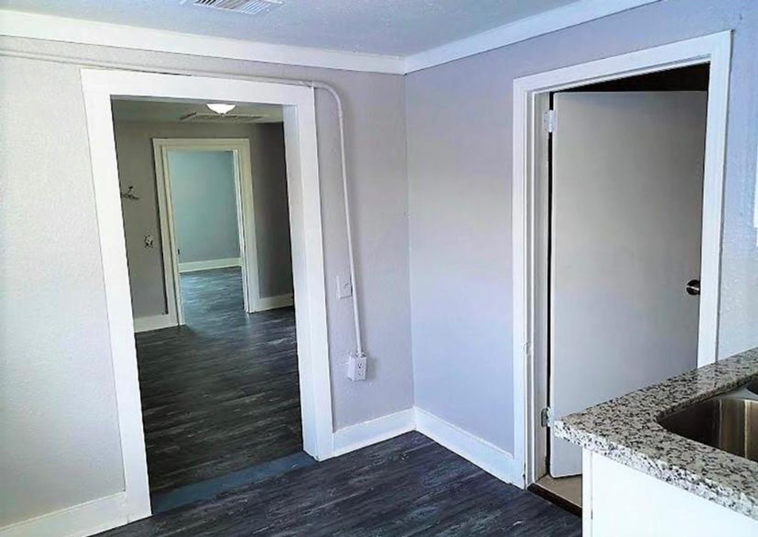 412 North 8th Street, Unit 1 Pasadena, TX 77502 - Photo 3 of 17 a view of entryway and hall with wooden floor