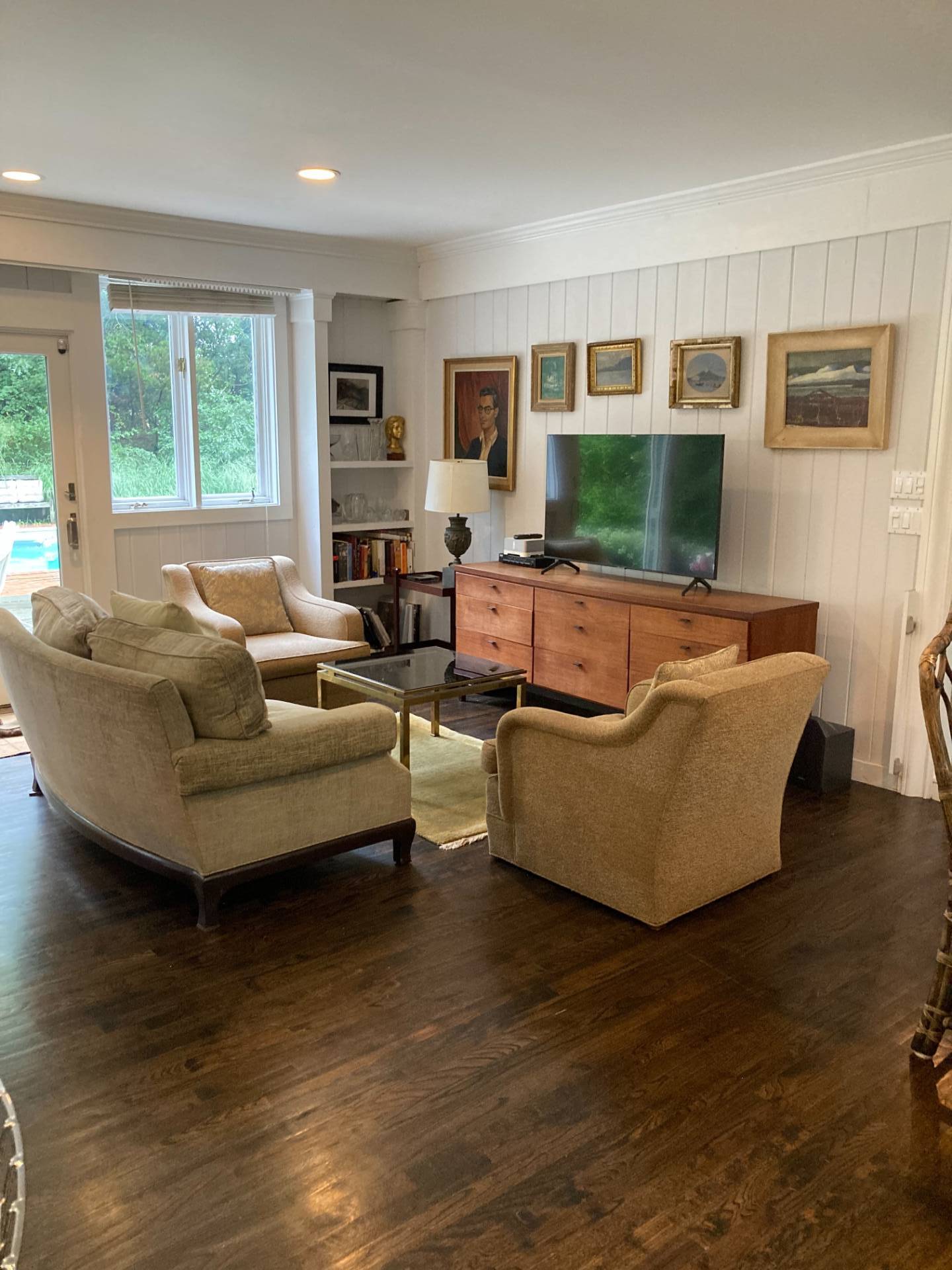311 Meadows West Bridgehampton, NY 11932 - Photo 4 of 11 a living room with furniture and a flat screen tv