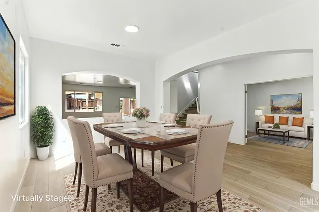a view of a dining room with furniture and wooden floor