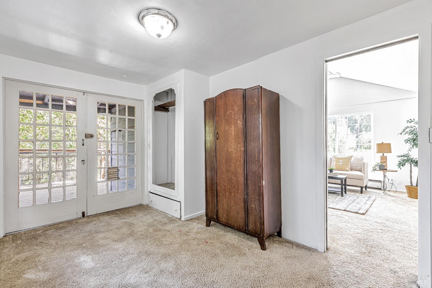 9199 Rio Vista Road Forestville, CA 95436 - Photo 16 of 33 Second bedroom with French doors leading to outdoor deck