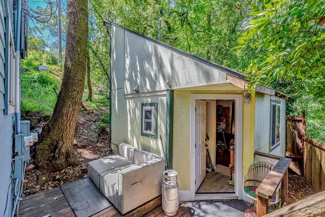 a living room with furniture and kitchen view