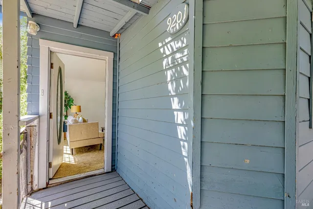 a view of a wooden door of the house