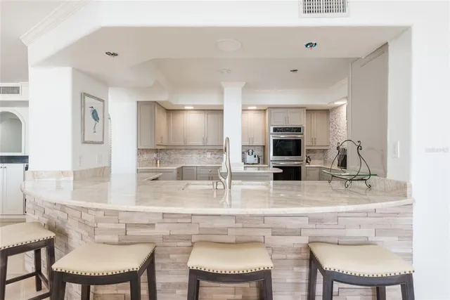 a bathroom with a double vanity sink and mirror