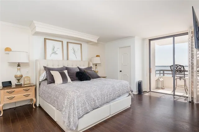 a spacious bedroom with a large bed and a view of bedroom