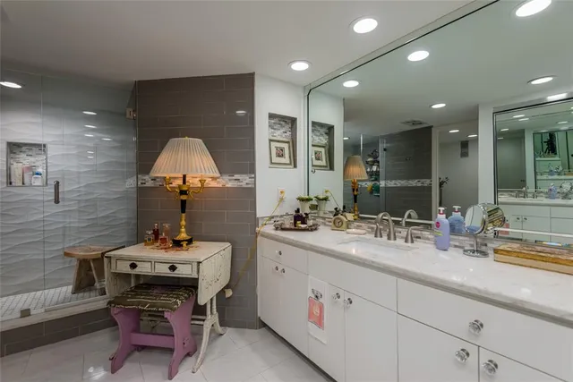 a view of a swimming pool with outdoor seating