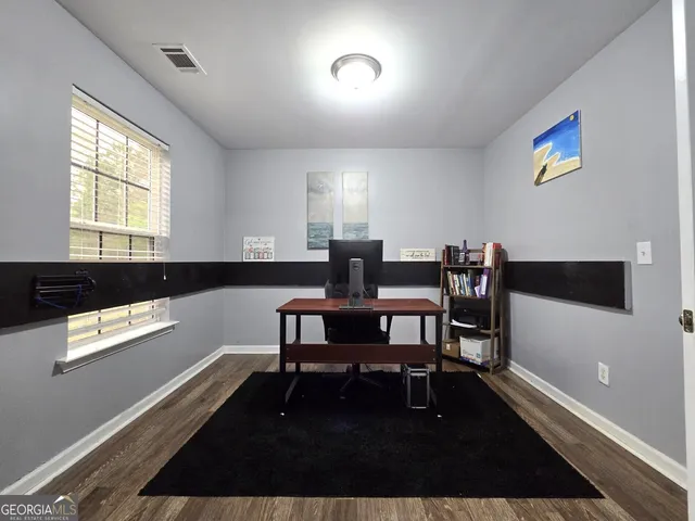 a view of a workspace with furniture