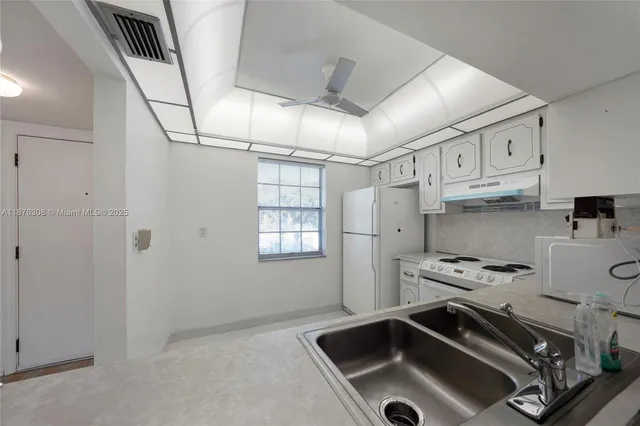 a view of a door and an empty room