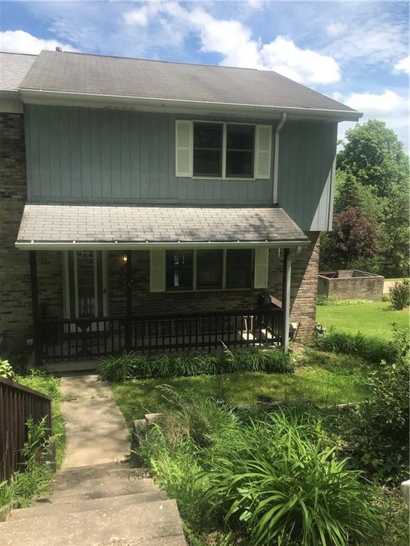 1200 McGovern Road, Unit E Houston, PA 15342 - Photo 1 of 16 End unit lets you enjoy the side yard. Enjoy the front porch on cool summer nights