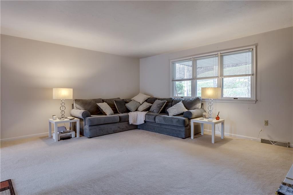 1200 McGovern Road, Unit E Houston, PA 15342 - Photo 2 of 16 Entertainment sized Living room in neutral dcor