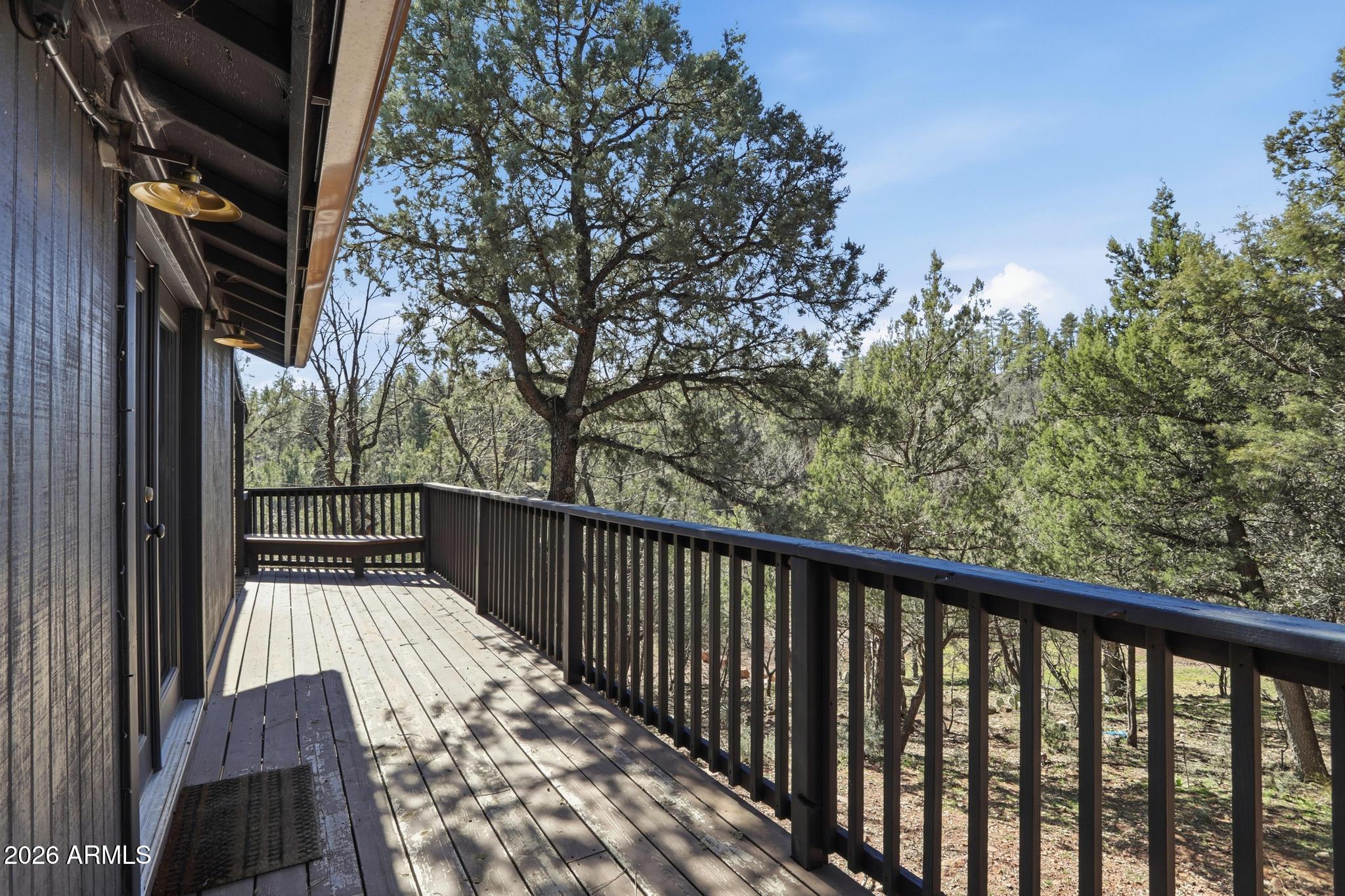 3422 Limestone Way Pine, AZ 85544 - Photo 23 of 35 a view of balcony with wooden floor and fence