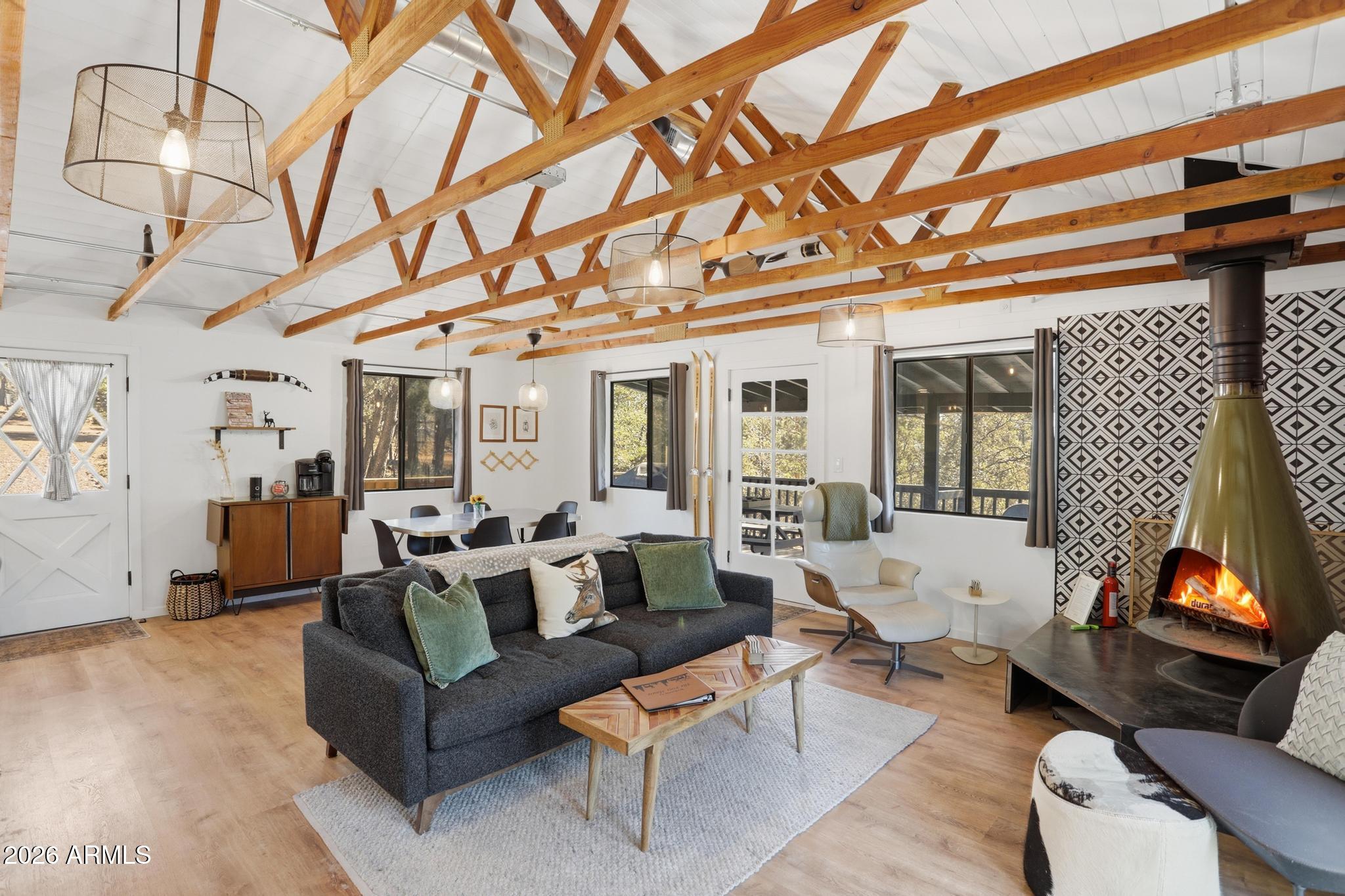 3422 Limestone Way Pine, AZ 85544 - Photo 3 of 35 a living room with furniture a couch and a fireplace