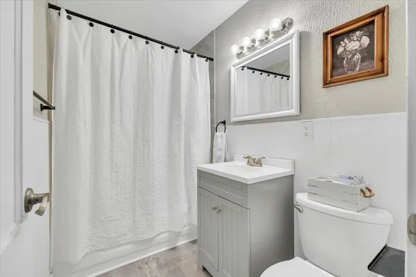 a very nice looking room with wooden floor and a window