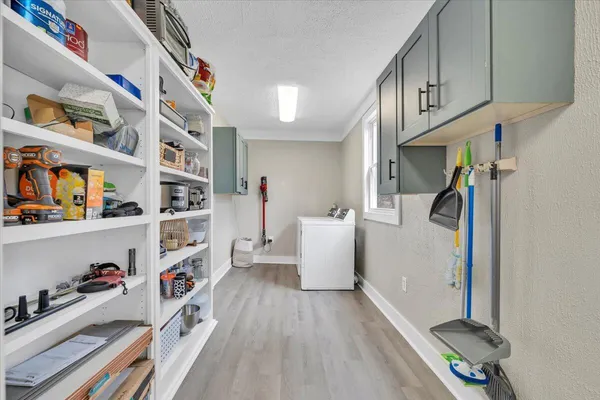 a bedroom with a bed and dresser
