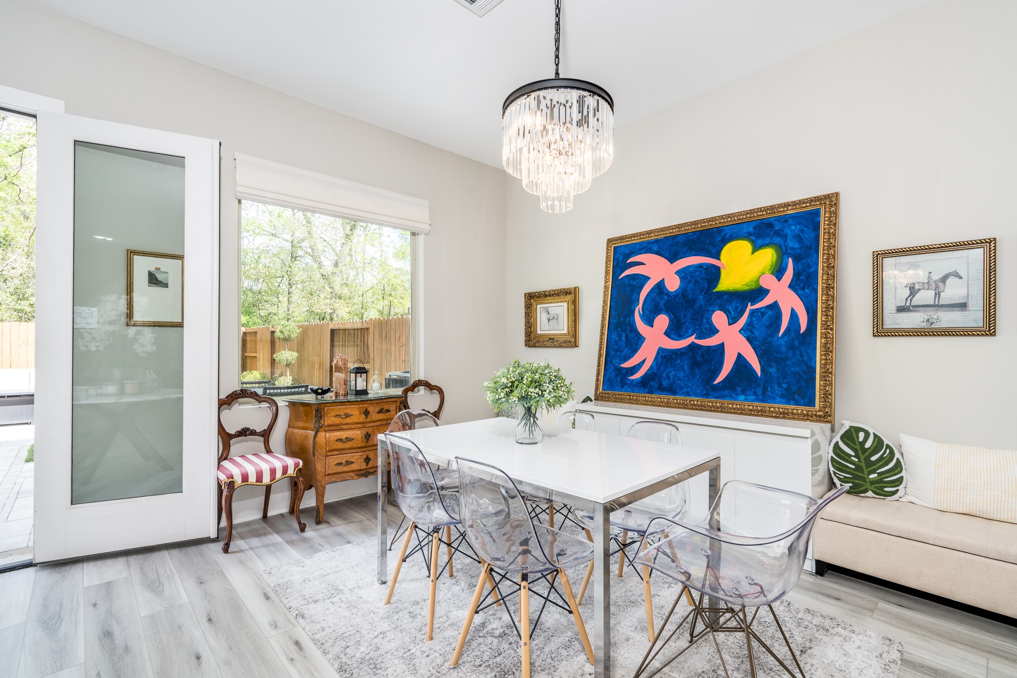 4926 Wunder Way Houston, TX 77069 - Photo 11 of 39 a view of a dining room with furniture a chandelier and wooden floor