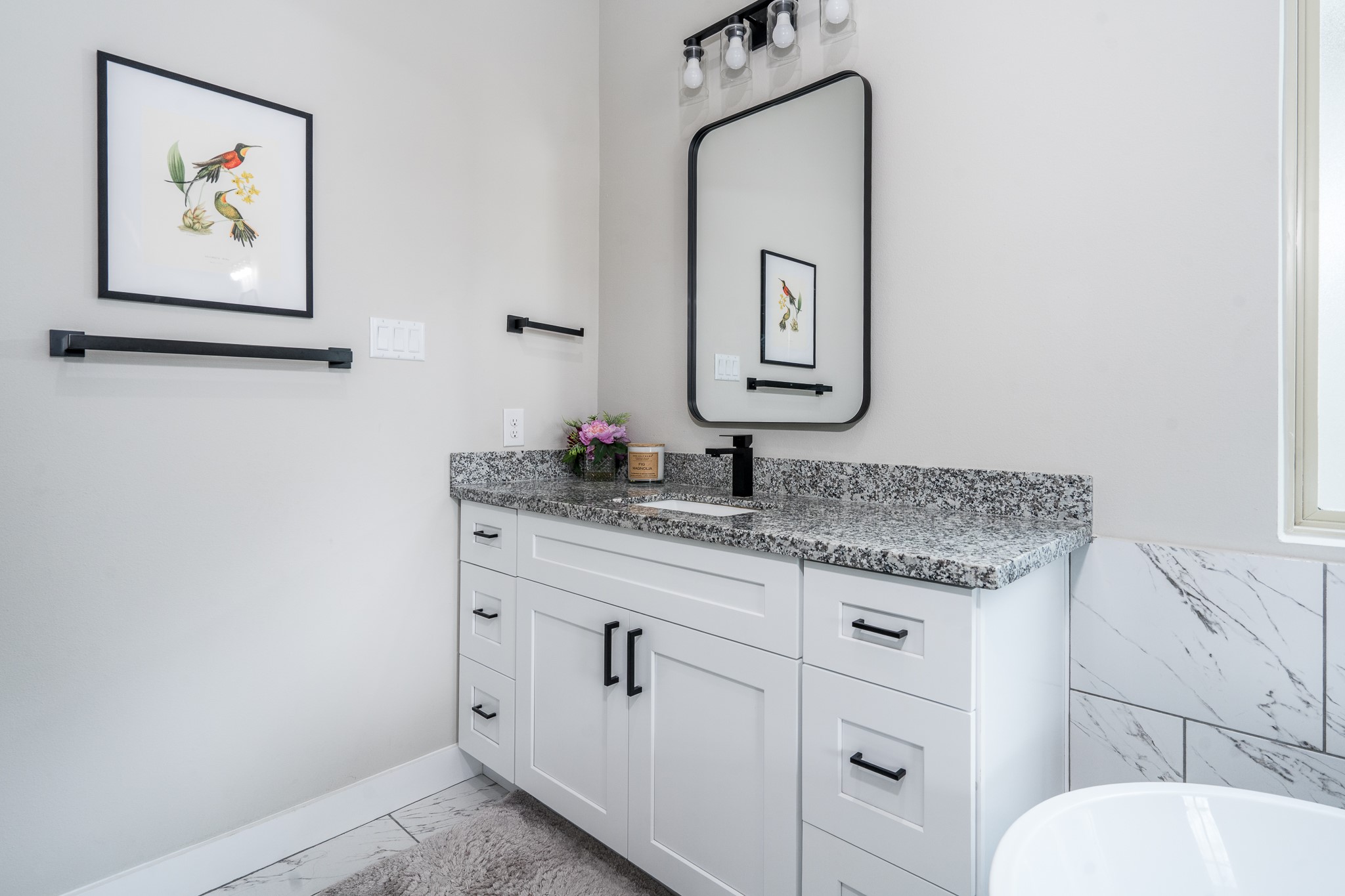 4926 Wunder Way Houston, TX 77069 - Photo 20 of 39 a bathroom with a granite countertop toilet sink and mirror