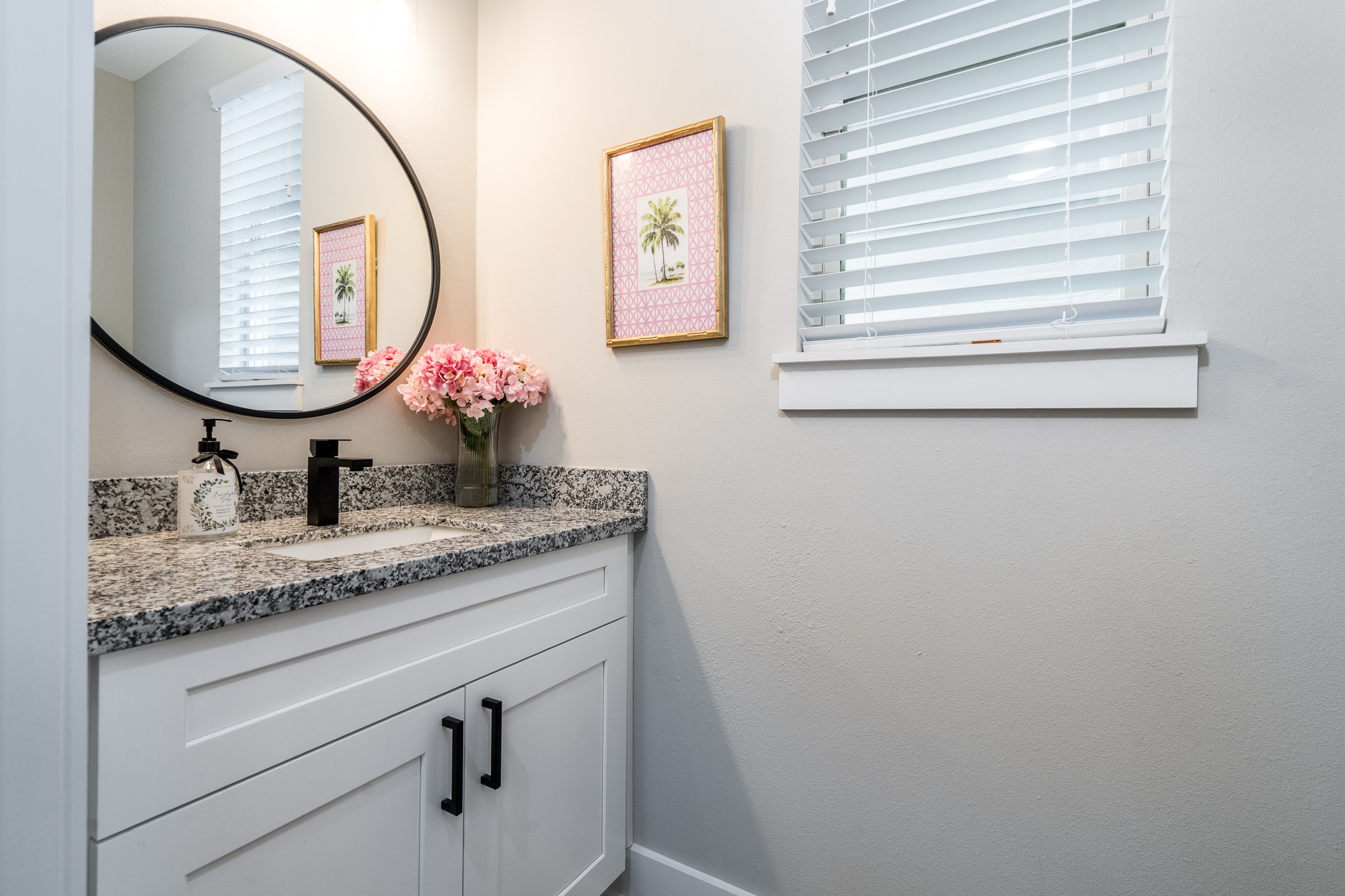 4926 Wunder Way Houston, TX 77069 - Photo 27 of 39 a bathroom with a granite countertop sink mirror and vanity