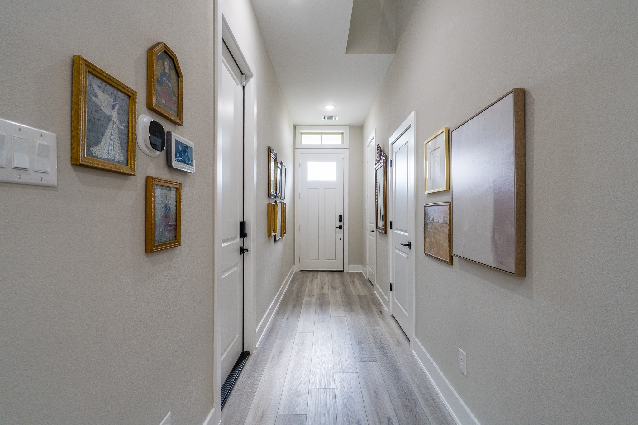 4926 Wunder Way Houston, TX 77069 - Photo 28 of 39 a view of a hallway with wooden floor and staircase