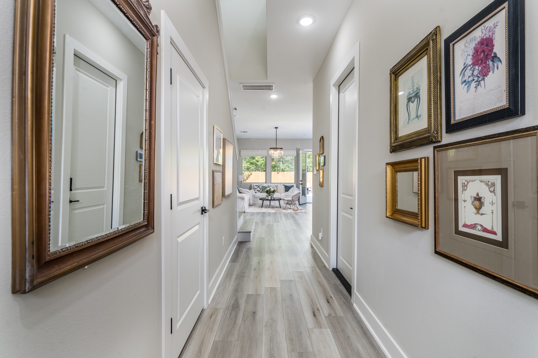 4926 Wunder Way Houston, TX 77069 - Photo 29 of 39 a view of a hallway with wooden floor and furniture