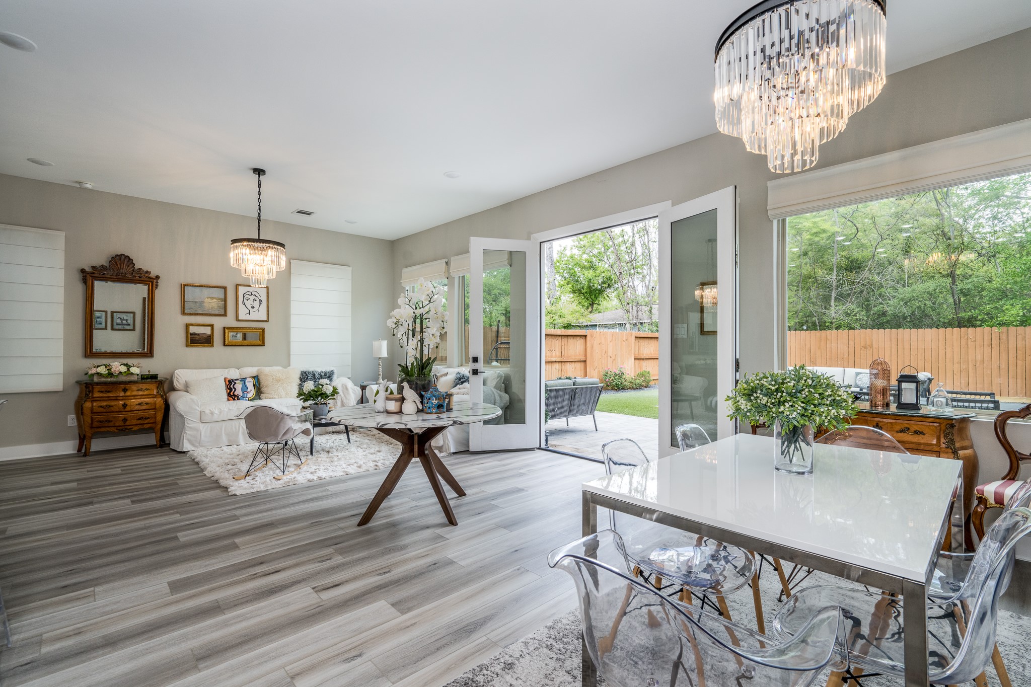4926 Wunder Way Houston, TX 77069 - Photo 10 of 39 a view of a dining room with furniture wooden floor and chandelier