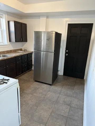 a kitchen with a sink and a window