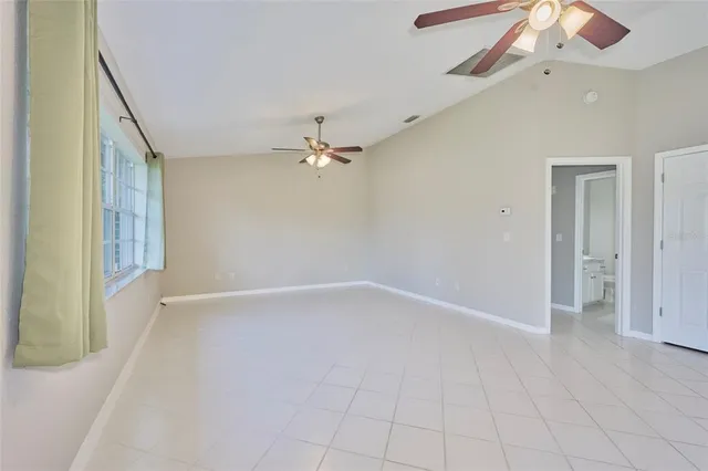 a view of an empty room with a window