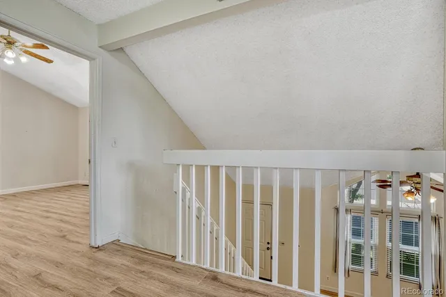 a view of an entryway with wooden floor