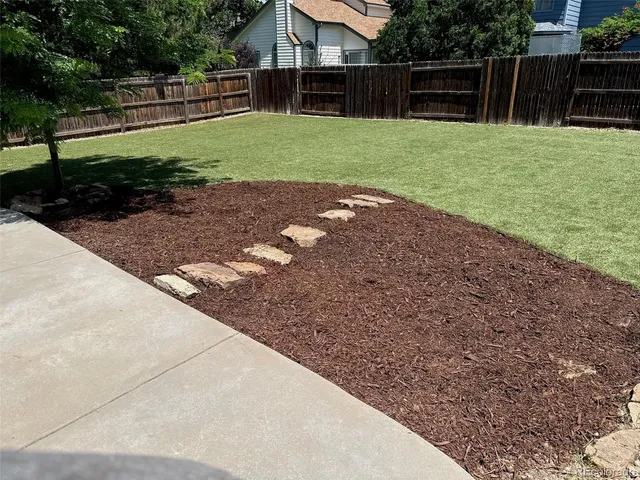 a view of a backyard with green space