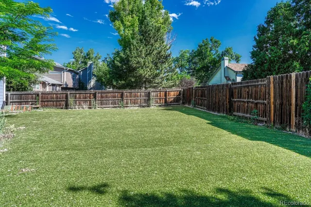a backyard of a house with lots of green space