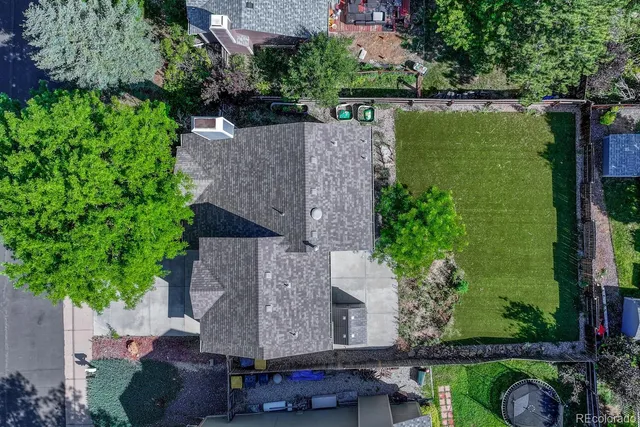 an aerial view of house with yard swimming pool and outdoor seating
