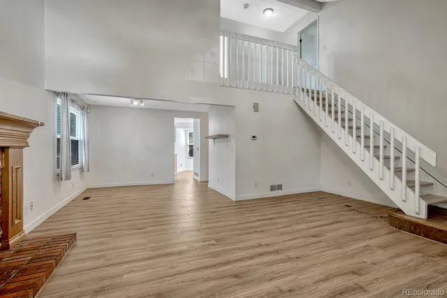 a view of entryway with wooden floor
