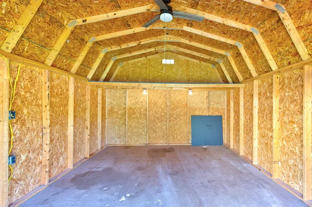 a backyard of a house with plants and garden