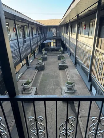 a view of balcony with furniture and wooden floor
