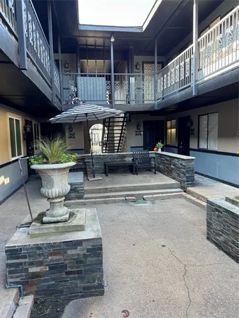 a view of a building with sitting area