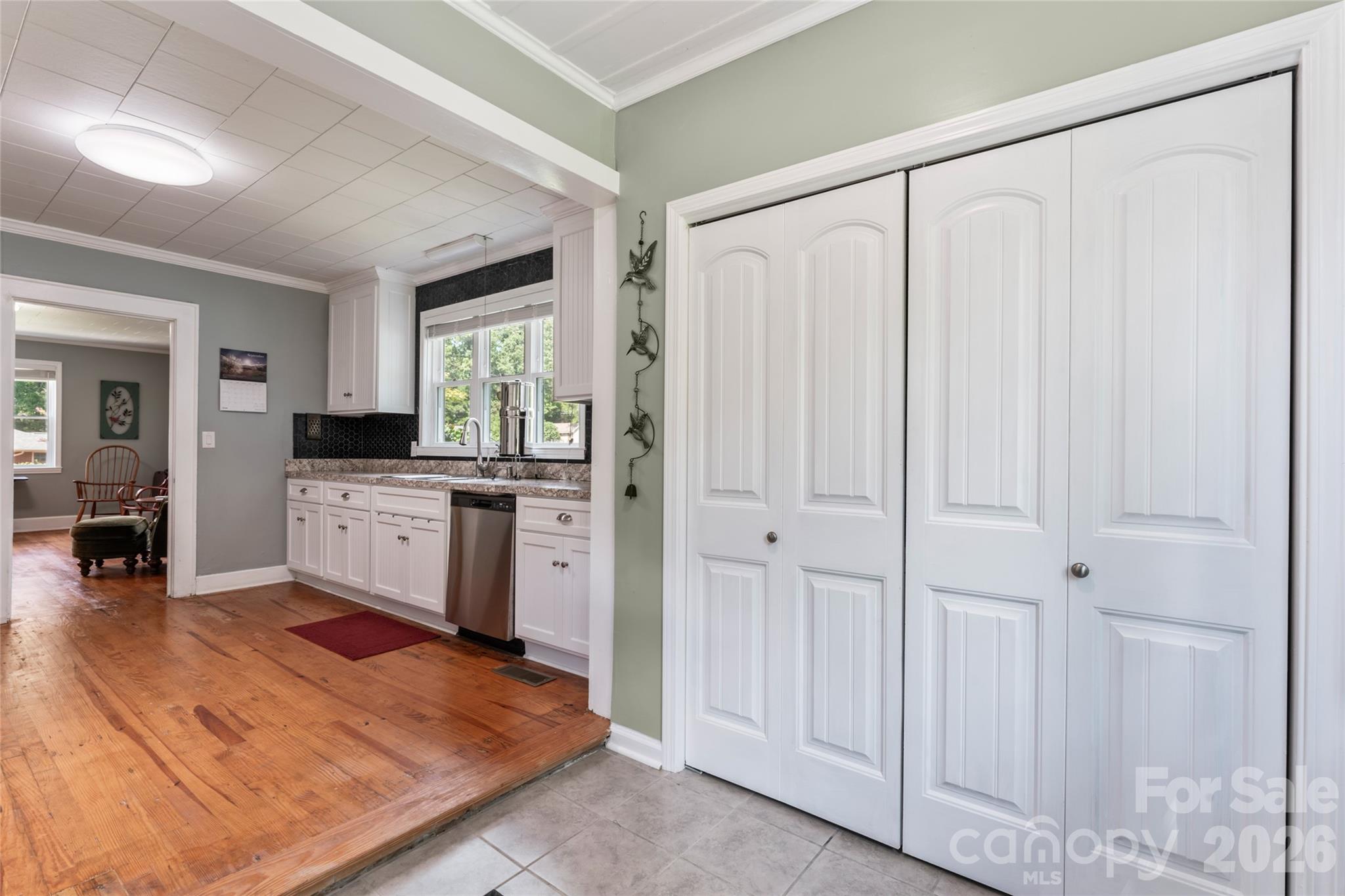 223 Wiley Avenue York, SC 29745 - Photo 14 of 40 a kitchen with white cabinets and white appliances