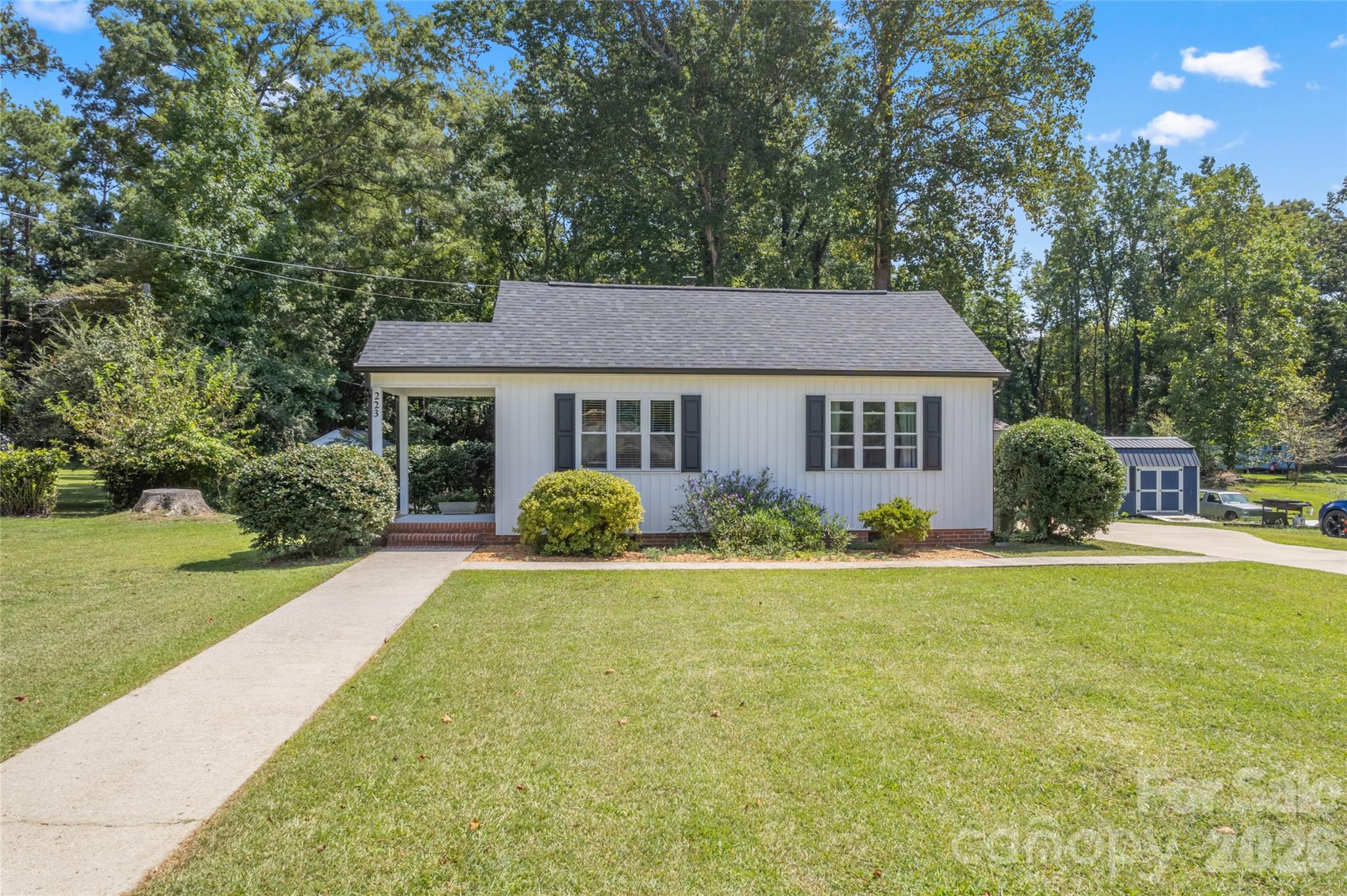 223 Wiley Avenue York, SC 29745 - Photo 2 of 40 a front view of a house with a yard and garage