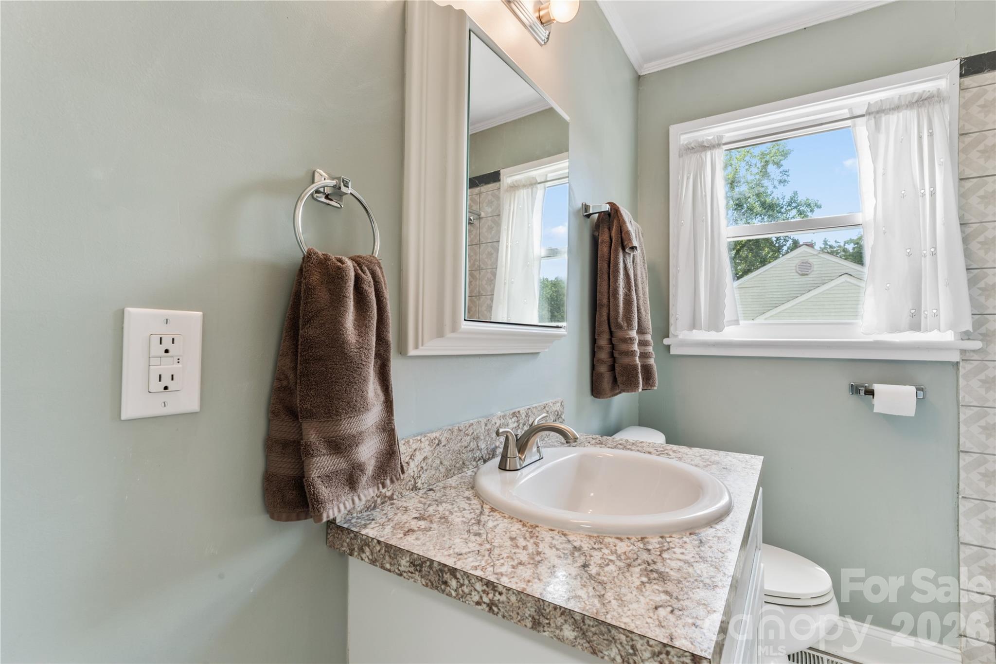 223 Wiley Avenue York, SC 29745 - Photo 24 of 40 a bathroom with a granite countertop sink and a mirror