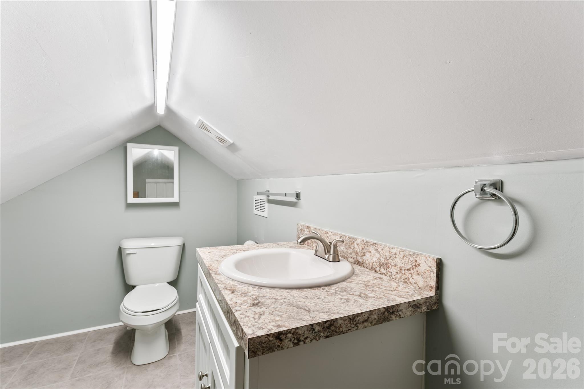 223 Wiley Avenue York, SC 29745 - Photo 27 of 40 a bathroom with a granite countertop sink a toilet and a mirror