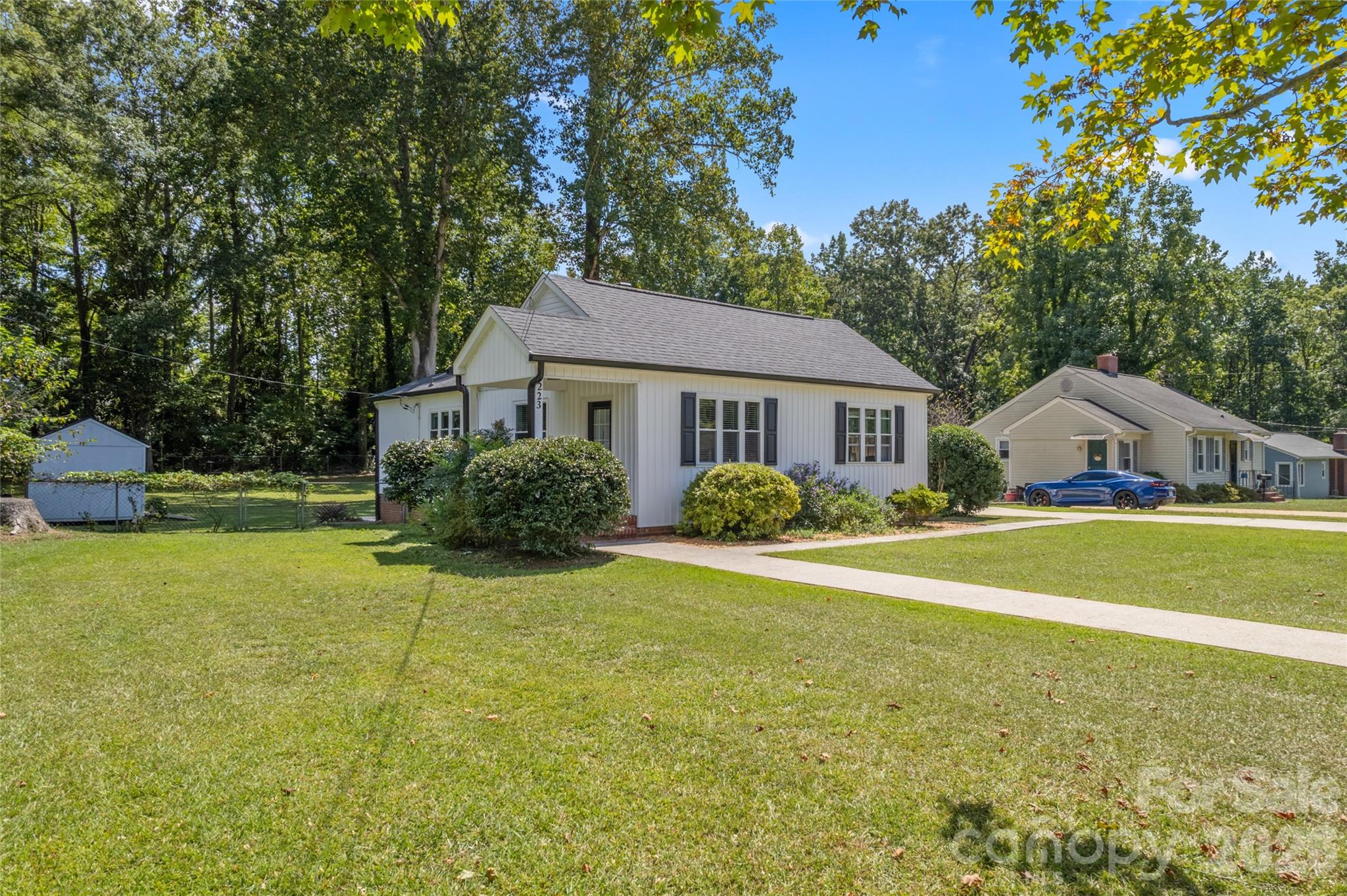 223 Wiley Avenue York, SC 29745 - Photo 3 of 40 a front view of a house with a garden