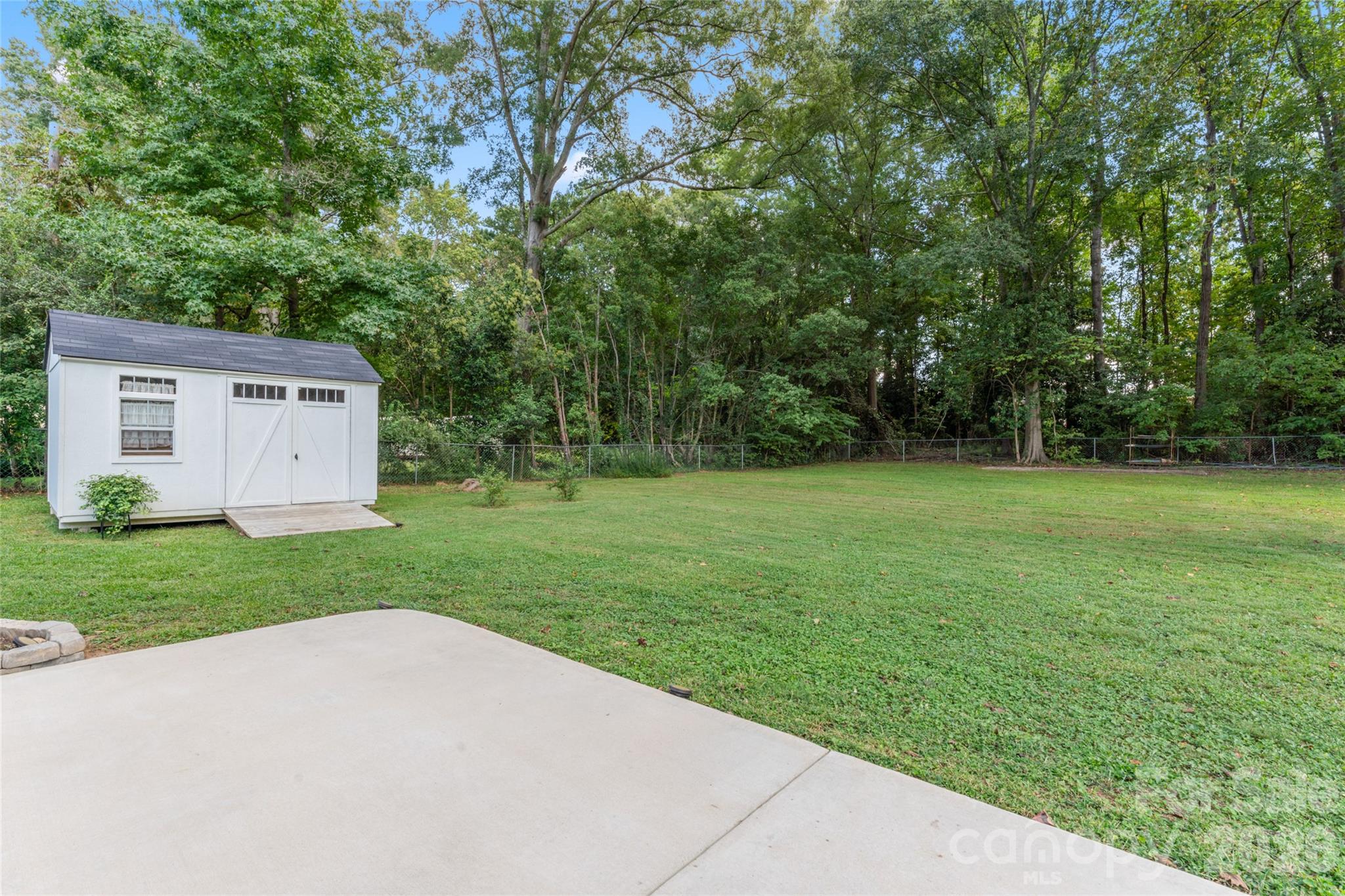 223 Wiley Avenue York, SC 29745 - Photo 32 of 40 a view of a backyard with large trees