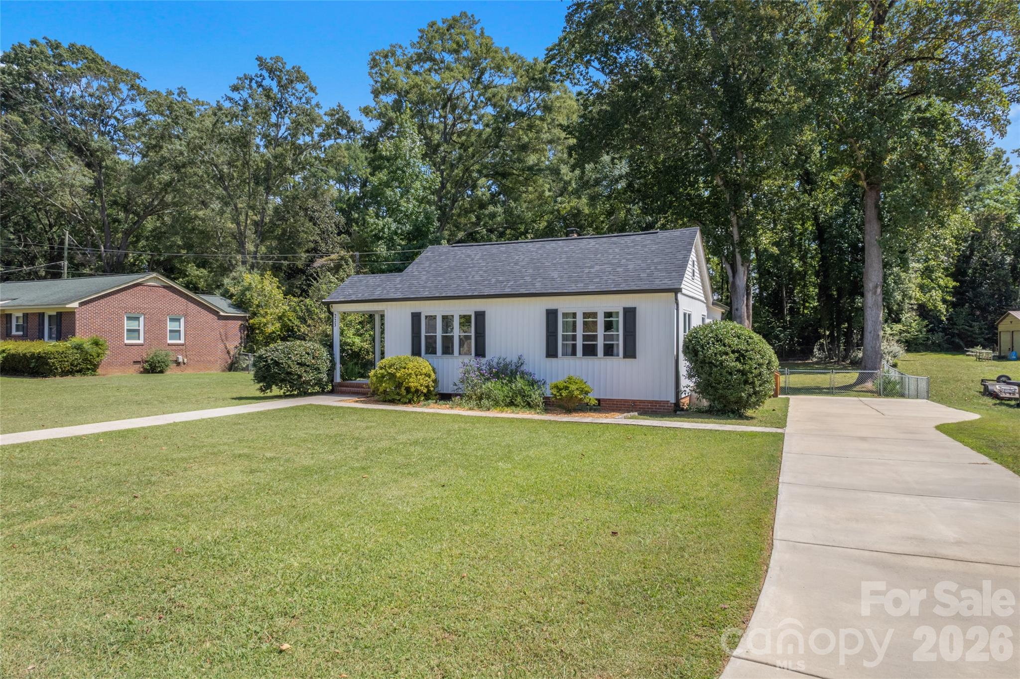 223 Wiley Avenue York, SC 29745 - Photo 34 of 40 a front view of a house with a yard and trees