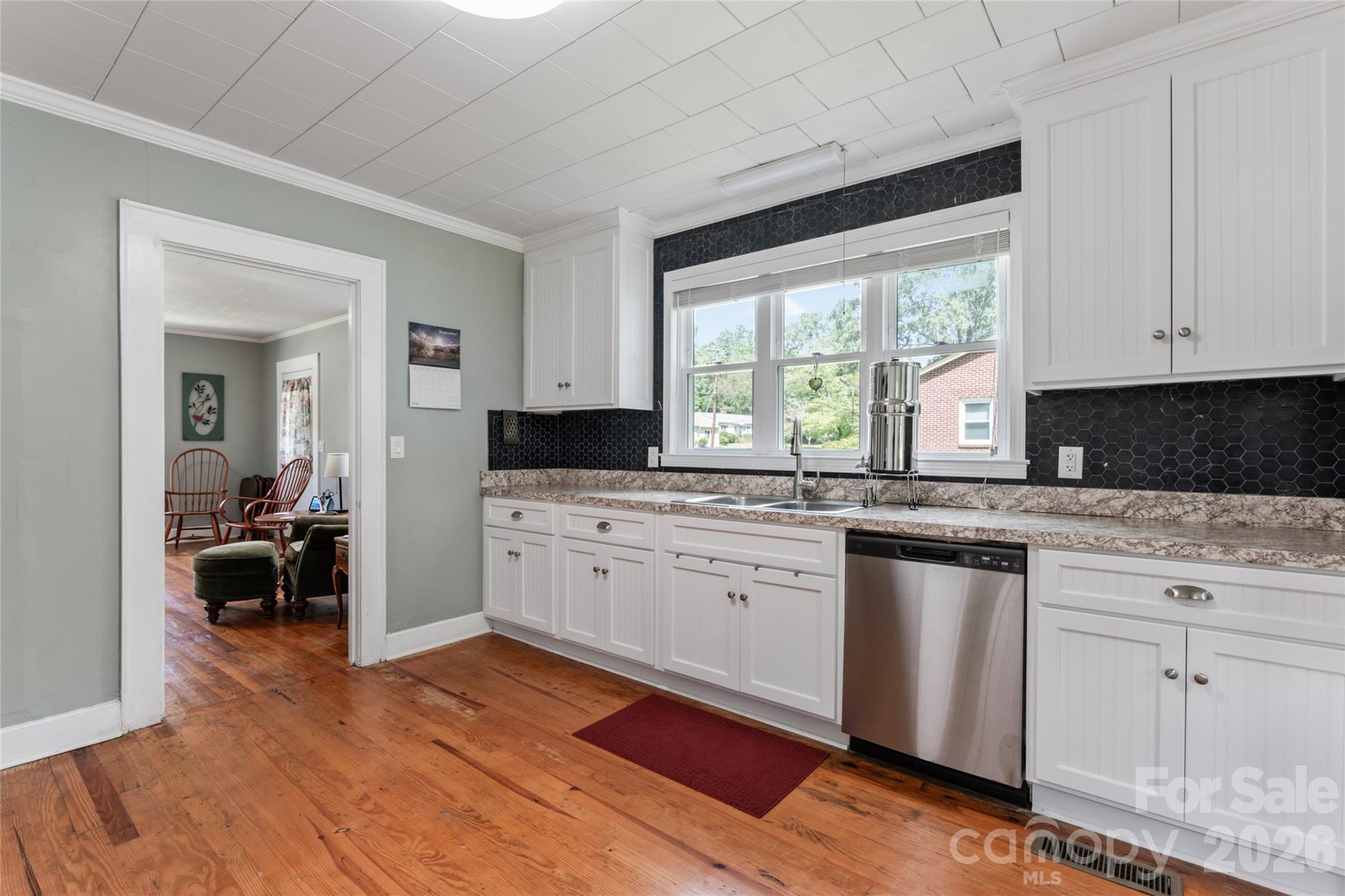 223 Wiley Avenue York, SC 29745 - Photo 10 of 40 a kitchen with granite countertop a stove a sink and a refrigerator