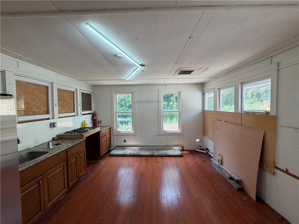 2552 Spring Street Coplay, PA 18037 - Photo 20 of 33 Ready for your personal touch, this kitchen space features warm wood flooring and abundant natural light.