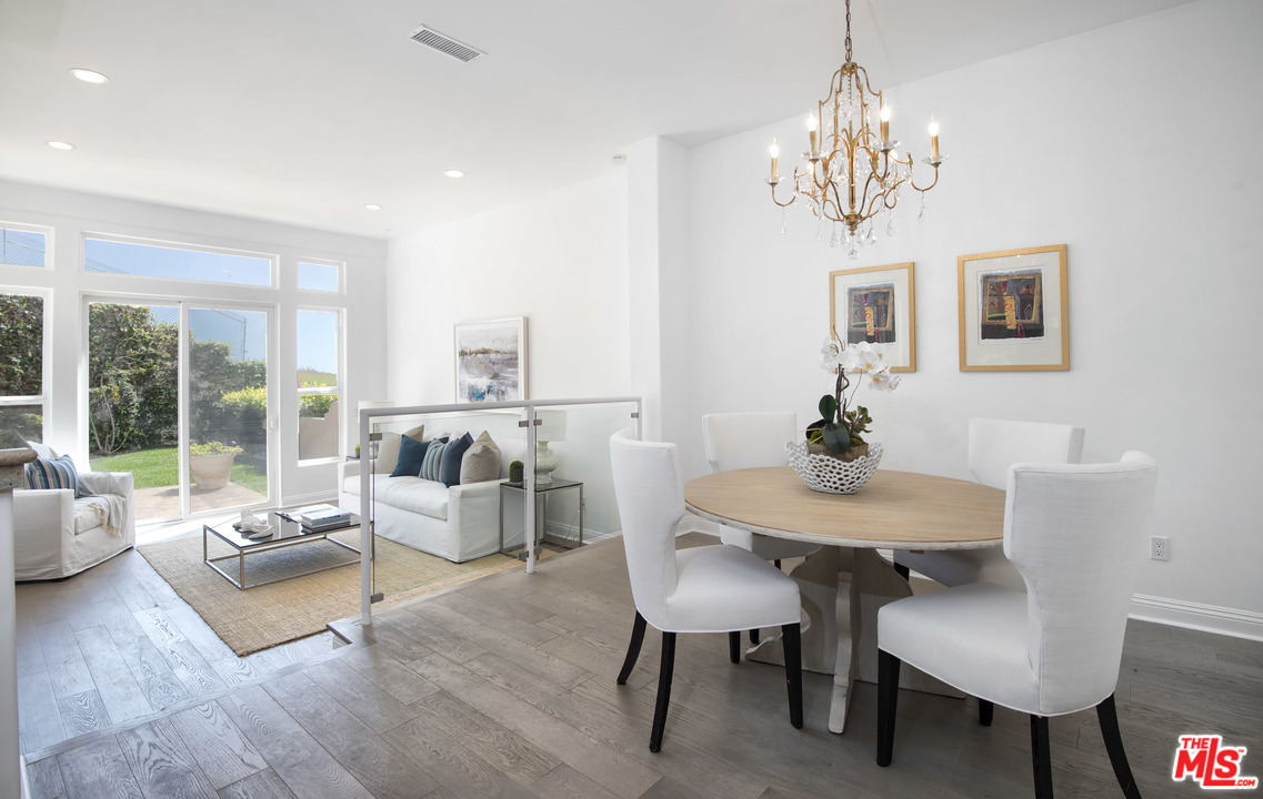 6450 Lunita Road, Unit 122 Malibu, CA 90265 - Photo 3 of 32 a living room with furniture and a chandelier
