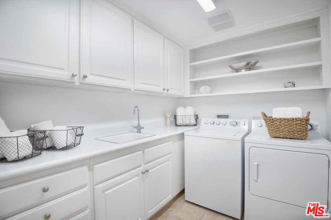 6450 Lunita Road, Unit 122 Malibu, CA 90265 - Photo 23 of 32 a view of storage and utility room with washer and dryer